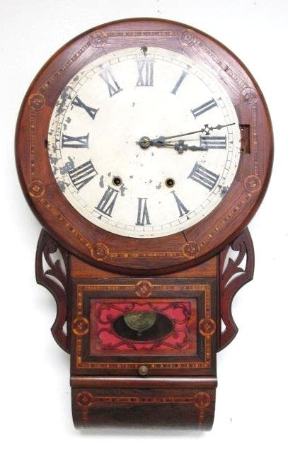 NEW HAVEN CLOCK CO PARQUETRY INLAID WALL CLOCK: New Haven Clock Company parquetry inlaid wall clock with a hand painted Roman numeral dial and carved wood fretwork decoration. Original movement appears to be running, but may need service for prolon