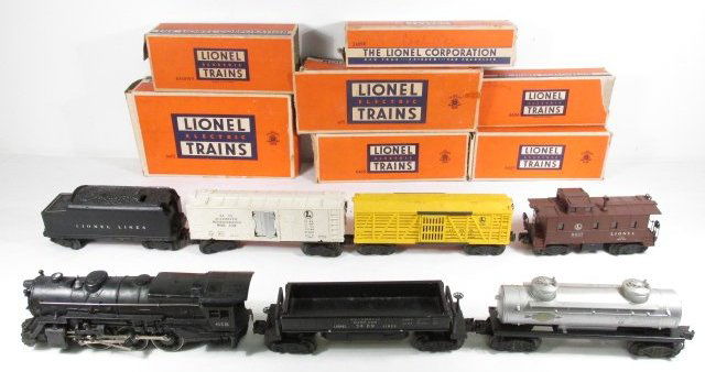 VINTAGE POST-WAR LIONEL TRAIN STEAM ENGINE & CARS: Vintage post-war Lionel train set. Includes 675 Steam Engine, coal car, dump car, refrigerated milk car, Sunoco fuel car, a yellow freight car, and the caboose. Each car includes box. Condition: damag