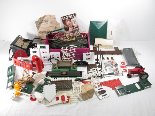 VINTAGE LIONEL TRAIN TRACKS & ACCESSORIES: PLASTICVILLE: Lot of vintage Lionel (Post-war) Trains tracks and other accessories. Includes transformer and power control, as well as tracks, plastic Ville parts, and more. Condition: signs of wear and age to all