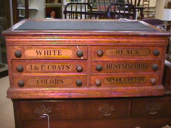 LG ANTIQUE J P COATS SPOOL CABINET: LG ANTIQUE J P COATS SPOOL CABINET Six drawer desk with original knobs, some stains on wood top and some small nicks. Measures 32 3/4" long by 22 3/4" wide and 14" tall.(updated 4/26/04 - 6 PM EST - T