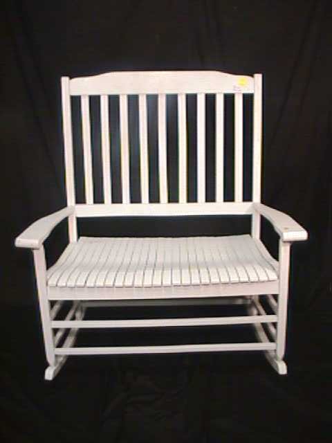 WOODEN SLAT BACK WHITE ROCKER SETTEE: WOODEN SLAT BACK WHITE ROCKER SETTEE Generally good condition. Measures 46" tall by 44 1/2" wide and 26 1/2" deep.