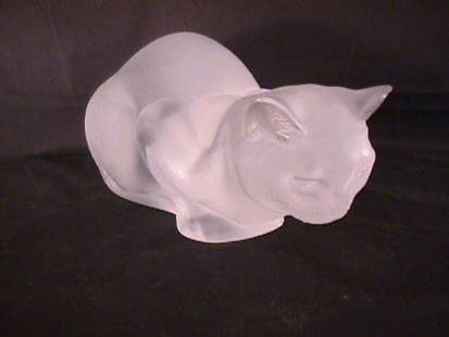 LARGE LALIQUE CRYSTAL CAT: LARGE LALIQUE CRYSTAL CAT Lalique cat measures 9 1/2" long x 5" wide x 4 1/2" high. Very small chip to rim of one ear. Three slight brush marks on body, light surface scratches to base.