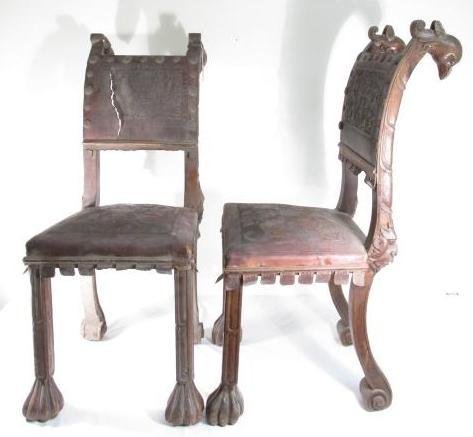 PAIR 19TH C CARVED WALNUT TOOLED LEATHER CHAIRS: Pair of early 19th century carved walnut side or dining chairs with tooled leather seat and back. Chair ears are carved in the form of an unusual bird's head. Each chair is also carved with a Northwin