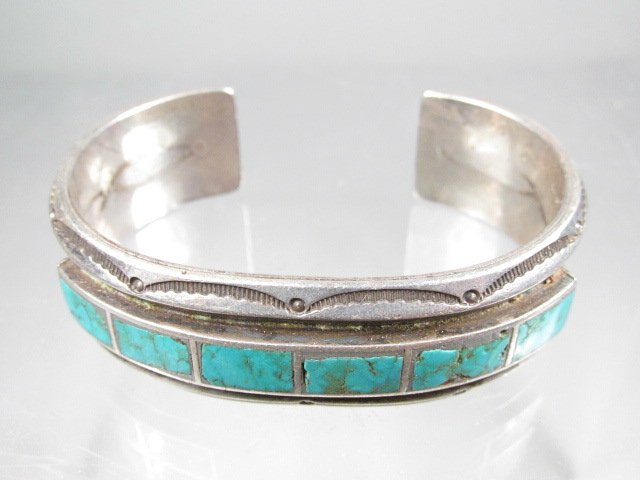 FRED THOMPSON NAVAJO SILVER & TURQUOISE BRACELET: Navajo sterling silver and turquoise bracelet by Fred Thompson. Marked on the inner band with Fred Thompson maker's mark. Condition: minor signs of age and wear to finish, see images. Measures a total