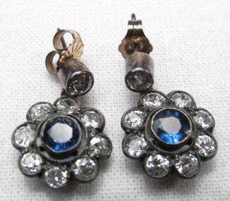 PAIR OF VINTAGE SMALL DIAMOND & SAPPHIRE EARRINGS: Pair of vintage small diamond and sapphire post earrings. Stones are set in a sterling silver base. Unmarked as to maker or purity. Condition: minor signs of wear and age, some tiny mars to silver set