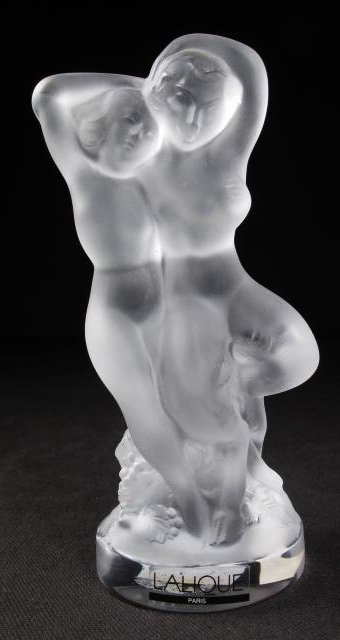 LALIQUE "FAUNE" FROSTED CRYSTAL DOUBLE NUDE FIGURE: Lalique "Faune" frosted crystal double nude figure. Depicts a woman with a Faun. Signed on edge of base "Lalique France", and also marked at base with sticker label. Condition: good, no signs of damag