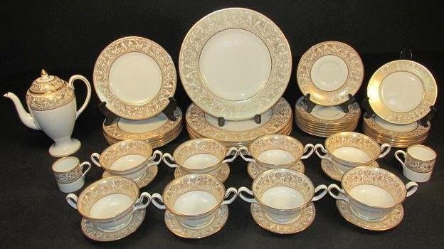 WEDGWOOD "GOLD FLORENTINE" GILDED PORCELAIN DINNERWARE:: Wedgwood "Gold Florentine" gilded porcelain dinnerware. Includes (8) 6" plates, (8) 4.75" plates, (2) 2.25" tall demitasse saucers, (8) 6.25" saucers, (1) 8.75" tall teapot, (8) 8.25" plates, (8) 6.5"