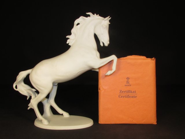 KAISER GERMAN PORCELAIN HORSE STALLION FIGURE: Kaiser German white porcelain stallion figurine. A.K. Kaiser stamp on bottom, "Made in Western Germany". Signed on top of base, "C. Bochuraun". Measurements: approx. 10.5" x 3.5" x 11.25". Includes ce