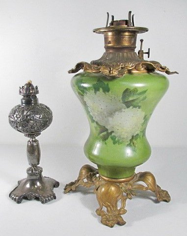 TWO VICTORIAN OIL LAMPS: HAND PAINTED, SILVER PLATED: Two antique oil lamps: (1) 16" tall hand painted hydrangeas on a heavy glass base, decorated with detailed floral metal base and top. The oil font insert is marked "Made in US of America" The base is