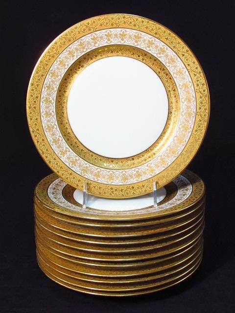 TWELVE WILLIAM GUERIN LIMOGES GILT PORCELAIN PLATES: Lot of twelve William Guerin Limoges parcel gilt porcelain 9.75" plates. Marked on base by "W, Guerin & Co, Limoges France". Also marked with green "Limoges W.G&Co Limoges Mark". Triple layer gilded b