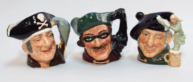 THREE ROYAL DOULTON CHARACTER TOBY JUGS LOT: Three Royal Doulton character toby jugs. Includes "Dick Turpin" D6528, "Long John Silver" D6335 and "Tam o' Shanter" D6632. Measurement: Approx 8" tall. Condition is good, with no chipping or cracks t