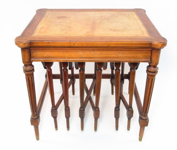 ITALIAN REGENCY STYLE LEATHER TOP NESTING TABLES: Small Italian Regency style leather top side table, containing three gate leg nesting tables. Main table measures: 19.75" tall x 21.5" wide and 18.5" deep. Marked on underside "Made in Italy". Conditi
