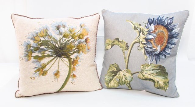 TWO FLORAL THROW PILLOWS: IOSIS, ETC.: Lot of two floral throw pillows. Includes one made by Iosis, France. Condition: good, no apparent tears, pulls, or stains, see images. Each p-pillow measures approx. 18". Weight: 5 lbs.