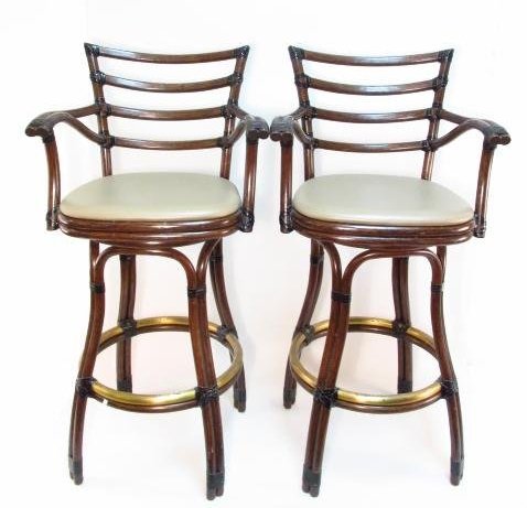 PAIR OF MCGUIRE BENT CANE & LEATHER BAR STOOLS: Pair of McGuire bent cane and leather bar stools. Each marked with a metal tag under the seat. Condition: minor wear to finish on lower metal foot rings, very light signs of use to upholstery, see ima