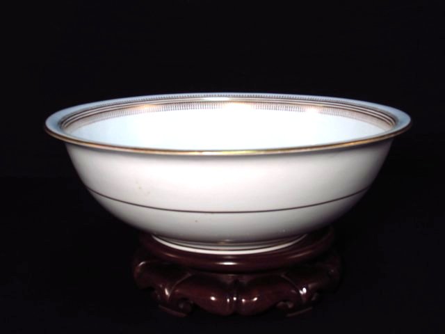 LARGE COPELAND SPODE PORCELAIN CENTER BOWL W/ STAND: Large Copeland Spode porcelain center bowl with wooden stand. Measures 15.5" in diameter, marked on base. Measures 7.6" tall when on stand. Condition: discoloration to porcelain in one spot along rim,
