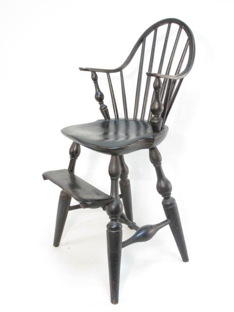 19TH C CHILD'S WINDSOR CURVED BACK HIGH CHAIR: 19th century child's Windsor high chair with a curved back measuring 33.5" tall x 17" wide. Condition: early repair to chair's right arm, see images. Weight: approx. 20 lbs.