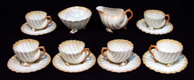 BELLEEK "NEPTUNE" PARTIAL DEMI-TEA SERVICE FOR SIX: A rare Belleek Irish porcelain partial demitasse tea service for six. "Neptune" pattern, all pieces with the black second mark, 1891 - 1926. Butterscotch tone trim on each piece. Includes (6) demitass