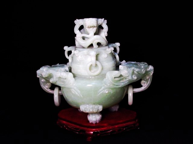 CHINESE CARVED JADE DRAGON CENSER: Chinese carved jade dragon censer. Sits upon three claw feet. Unsigned. Double loop handles on the base, triple loop on the lid. Includes fitted carved wood base. Condition: good, no chips, cracks, or