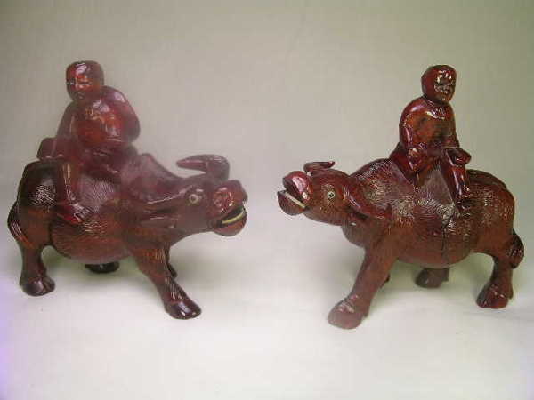 TWO CARVED WOODEN WATER BUFFALO