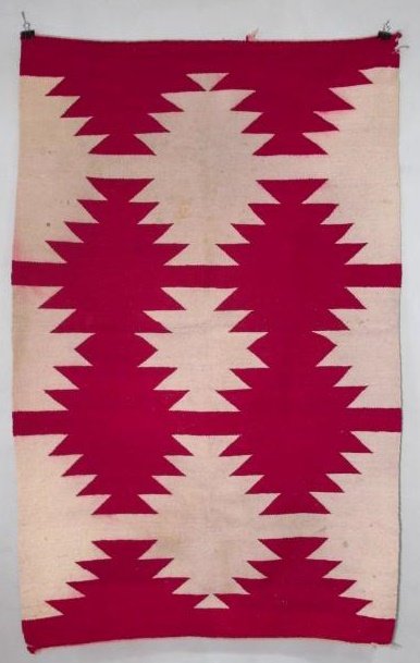 NAVAJO HAND WOVEN WOOL RUG - 40" x 61.5": Vintage Navajo hand knotted wool rug measuring 40" x 61.5". Red and white traditional design. Condition: very minor damage to end and corners, some slight bleeding, see images. Weight: approx. 4.1 lbs