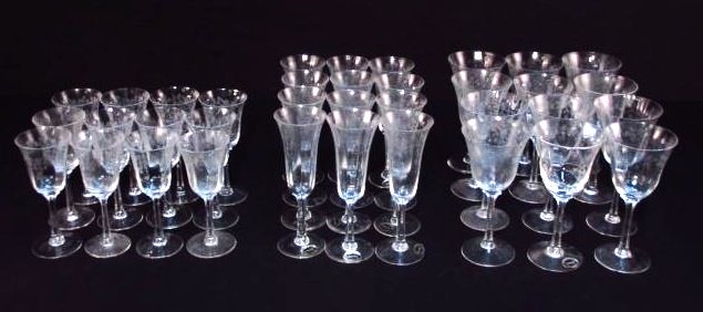 LENOX ETCHED CRYSTAL STEMWARE SERVICE FOR TWELVE: Lenox etched crystal stemware service for twelve. Includes (12) 7.5" tall wine stems, (12) 6.6" tall stems, and (12) 8" tall champagne flutes. All held in carrying cases. Condition: no chips or cracks