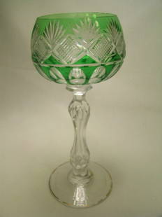GREEN CUT TO CRYSTAL WINE STEM: Lot 168: GREEN CUT TO CRYSTAL WINE STEM - Measures 6 31/4" high by 2 3/4 " wide. Some of the gilt is missing on the rim at the base of the stem. No chips or cracks.