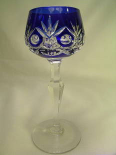 COBALT BLUE CUT TO CLEAR CRYSTAL WINE STEM: Lot 181: COBALT BLUE CUT TO CLEAR CRYSTAL WINE STEM - Measures 7 1/4" high by 3 " wide. No chips or cracks, good condition.