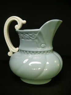 LENOX PORCELAIN TEAL BLUE WHITE CREAMER: Lot 276: LENOX PORCELAIN TEAL BLUE WHITE CREAMER - Measures 5" tall x 5 1/2" wide. No chips, cracks or crazing.