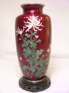 FINE SILVER WIRE JAPANESE CLOISONNE VASE RED: Lot69: FINE SILVER WIRE JAPANESE CLOISONNE VASE RED - Measures 7" tall by 3 1/2" wide. Condition very good but for one small star shaped ding on upper body near right side of top flower. Base marked