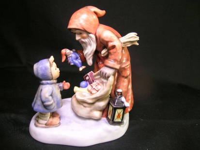 HUMMEL PORCELAIN FIGURINE ST NICHOLAS DAY 2012: Lot156: HUMMEL PORCELAIN FIGURINE ST NICHOLAS DAY 2012 - Measures 6 3/4". Trademark 7. Numbered 2012. No chips, cracks or crazing.