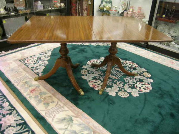 DUNCAN PHYFE STYLE DOUBLE PEDESTAL DINING TABLE: Lot 149: DUNCAN PHYFE STYLE DOUBLE PEDESTAL DINING TABLE - Measures 28 1/2" high x 62" wide x 42" deep. Each leaf is 8 1/2" wide.
