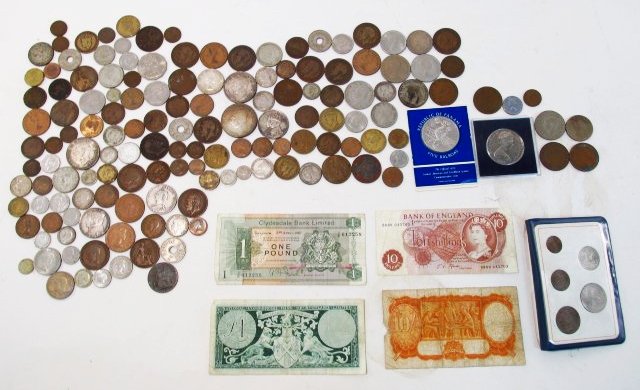 LARGE COLLECTION OF ASSORTED FOREIGN COINS & CURRENCY: A large collection of assorted foreign coins and currency. Includes currency from Britain, Australian, Fiji, West Indies, Canadian, Jamaica, New Zealand, Panama, and more. Wide variety of values and s