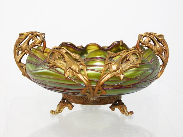 ANTIQUE PALME-KONIG ART NOUVEAU BOWL W/ BRONZE OVERLAY: Antique Palme-Konig Art Nouveau threaded glass bowl with floral bronze overlay. Sits upon three feet. Measures a total of 3.8" tall x 7.5" wide (handle to handle) and 6.5" deep. Condition: very minor 