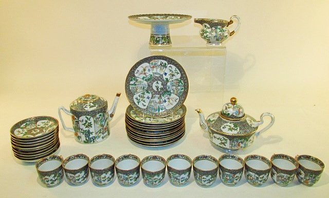CHINESE FAMILLE VERTE PORCELAIN DINNERWARE: 37 PCS: Chinese Famille Verte hand painted porcelain dinnerware. Includes a 9.5" wide x 4.25" tall compote, (1) 6.75" long creamer, (10) 5.5" wide saucers, (11) 2.4" tall cups, (12) 8" plates, (1) 5.75" tall 