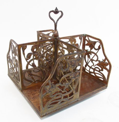 ART NOUVEAU BRASS & WOOD BOOK RACK OR LETTER STAND: Art Nouveau brass and wood book rack or letter stand. Sits atop a swivel base. Measures a total of 12.5" tall x 11.5" wide and 11.5" deep. Condition: signs of wear and age, some splitting to wooden ba