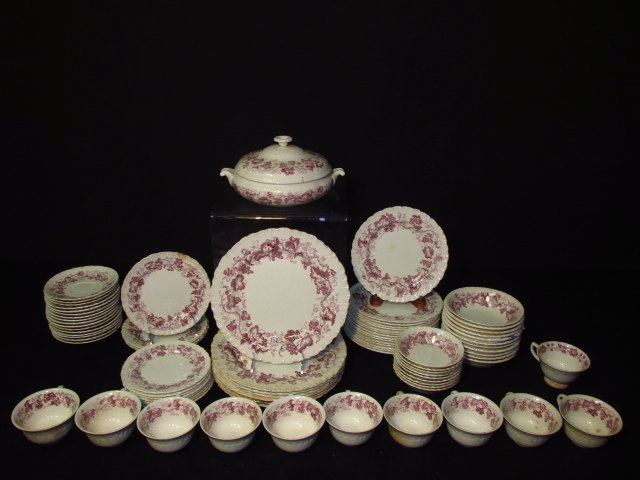 WEDGWOOD "OLD VINE" PORCELAIN DINNERWARE: Wedgwood "Old Vine" porcelain dinnerware. Includes Dinner plates, salad plates, bowls, bread plates, saucers, cups, tureen, and more. Condition: scattered chips and flakes, some minor staining, see im