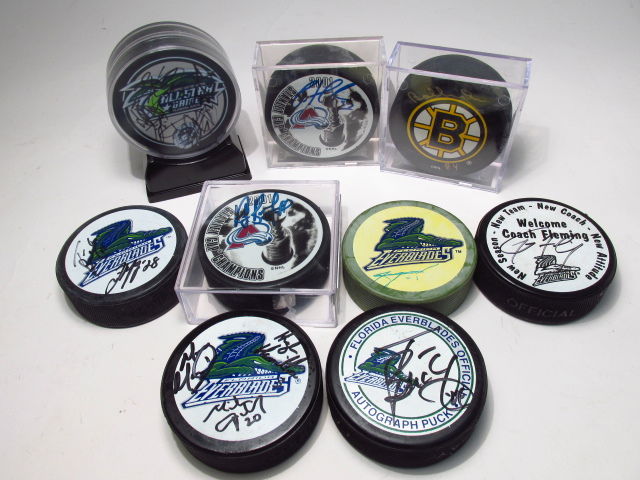 NINE PLAYER SIGNED HOCKEY PUCKS: BOBBY ORR, PATRIC (1 of 10)
