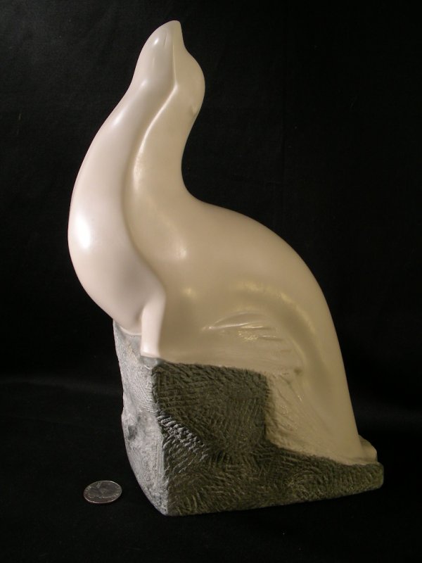 VINCENT GLINSKY SNOW SEAL 11 1/4" FOUNDRY STONE: Lot 22: VINCENT GLINSKY SNOW SEAL 11 1/4" FOUNDRY STONE - Probably released through Sculpture Collector's Ltd. Measures 11 1/2" tall by 8" by 4 1/4". Smooth and rough composition foundry stone. condit