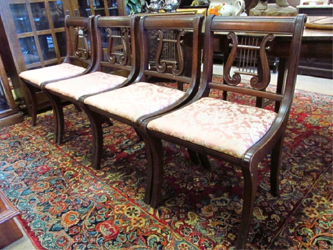 FOUR MAHOGANY & BRASS DINING OR SIDE CHAIRS: Lot of four mahogany and brass dining or side chairs measuring 33.5" tall x 19" wide x 20" deep. Condition: signs of wear/age, see images. Total weight: approx. 50 lbs.