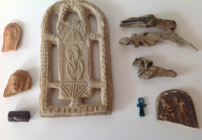 9 Assorted Antiquity Tyoes: 7 Terra-cotta pieces, one carved stone seal and one piece of Egyptian Faience. 2 pieces with collections notes on rear. Marked ex. Luen