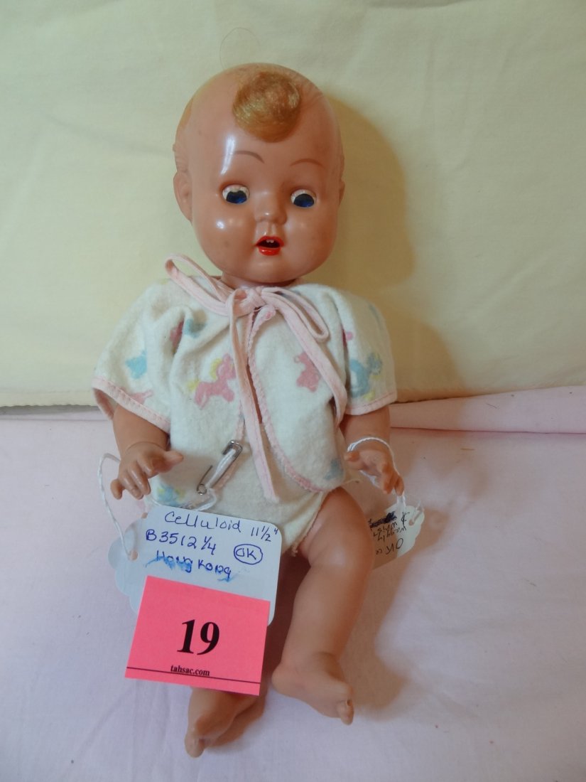 11 1/2'' ''ok'' CELLULOID BABY DOLL WITH WAGGLY TON: 11 1/2'' CELLULOID BABY DOLL WITH WAGGLY TONGUE, SLEEP BLUE EYES, CURL ON FRONT, MARKED " 3512 1/4 "OK" B3512 1/4 MADE IN HONG KONG"