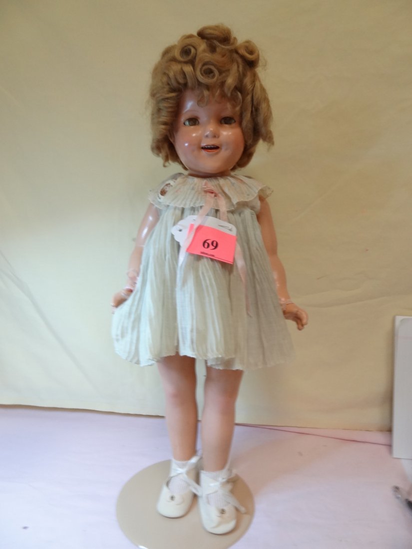 22'' SHIRLEY TEMPLE DOLL BY IDEAL. SLEEPY EYES, COM: 22'' SHIRLEY TEMPLE DOLL BY IDEAL. SLEEPY EYES, COMPOSITION HEAD AND BODY. JOINTED AT SHOULDERS AND HIPS.