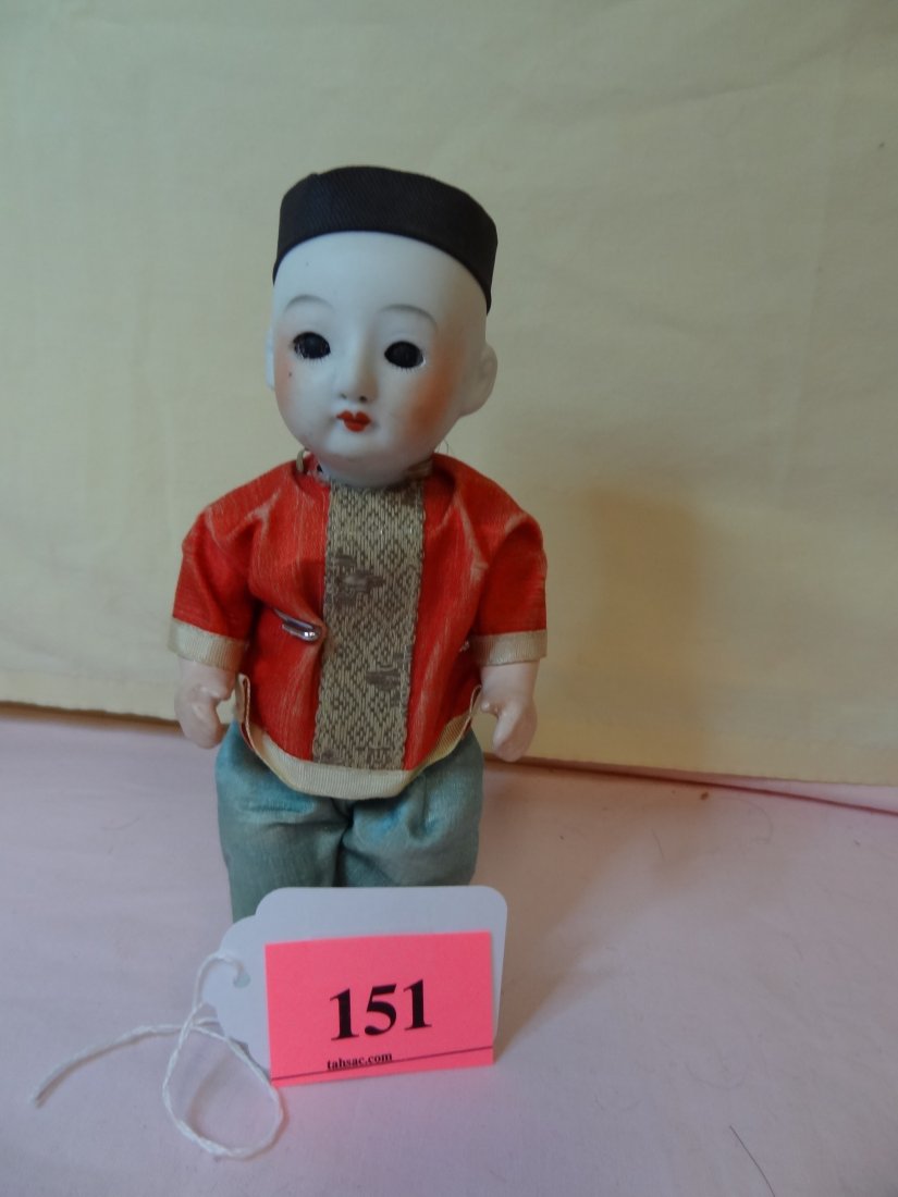7.5 ASIAN BOY DOLL. BISQUE HEAD, COMPOSITION BODY,: 7.5 ASIAN BOY DOLL. BISQUE HEAD, COMPOSITION BODY, MOVEABLE ARMS AND LEGS, BIG BROWN GLASS EYES, REMOVEABLE CAP WITH BRAIDED HAIR. MARKED 4/08