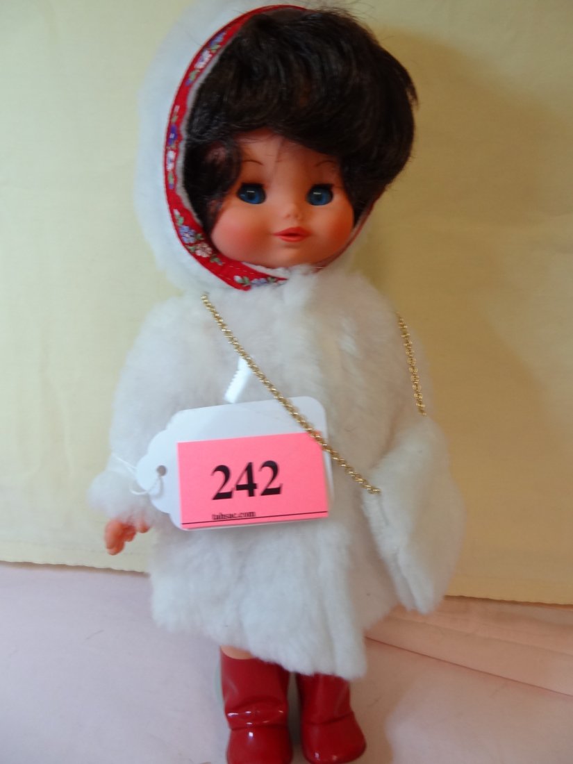 12'' RUBBER HEAD AND BODY, MOVABLE LIMBS, BROWN HA: 12'' RUBBER HEAD AND BODY, MOVABLE LIMBS, BROWN HAIR, BLUE SLEEPY GLASS EYES, ADORABLE RED AND WHITE COSTUME WITH FAUX FUR JACKET AND MUFF, MARKED ''PURGA ITALY''