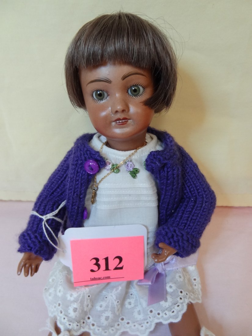 12'' BISQUE HEAD, PAINTED NEW COMPOSITION BODY: 12'' BISQUE HEAD, PAINTED NEW COMPOSITION BODY,MOVABLE LIMBS AND JOINTS, GREEN GLASS EYES, BROWN HAIR, PURPLE ADORABLE OUTFIT, MARKED ''UNIS FRANCE 71 301 749 A0 2002 1/14''