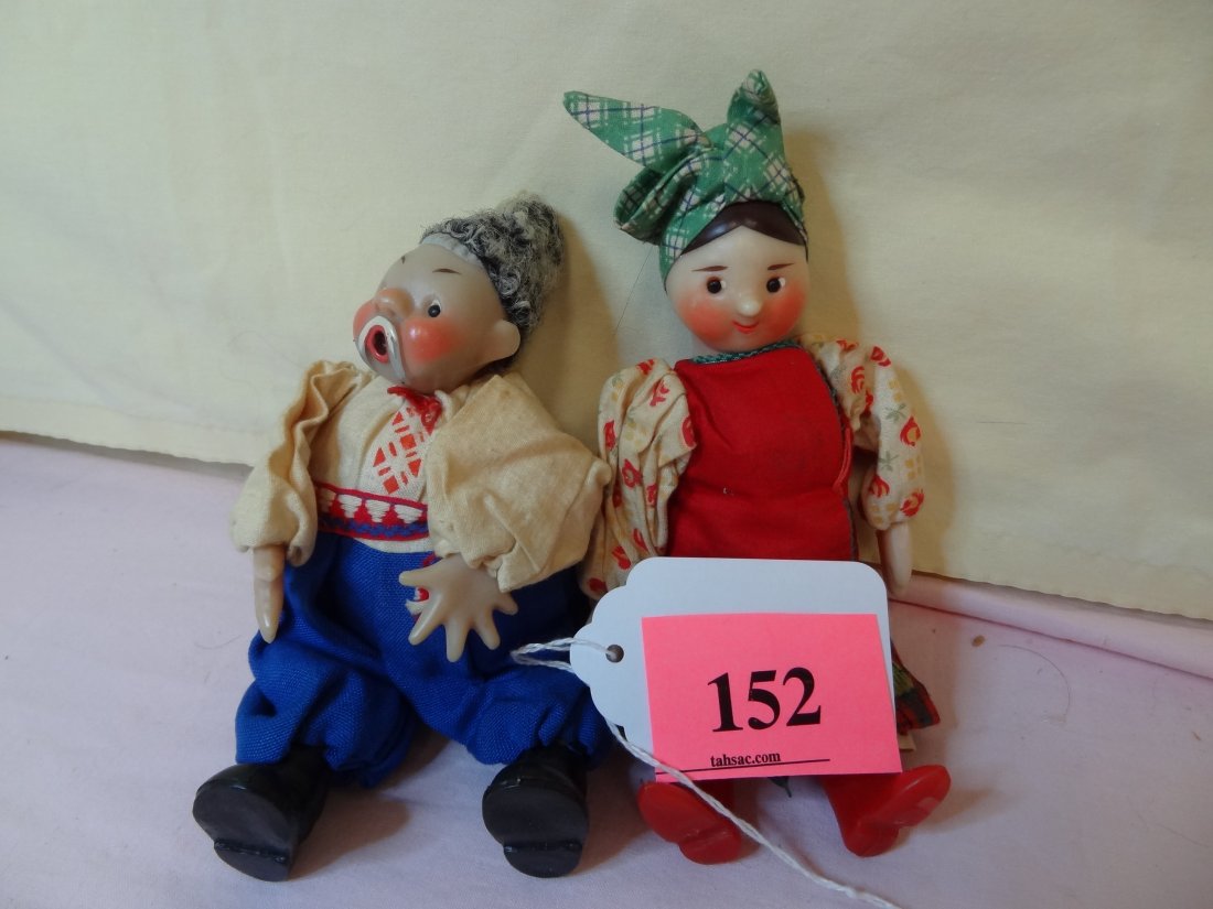 TWO UNIQUE PLASTIC AND CLOTH DOLLS. GIRL IS 7.5'',: TWO UNIQUE PLASTIC AND CLOTH DOLLS. GIRL IS 7.5'', THE GUY IS 7''. PLASTIC HEADS, HANDS AND FEET. SEEM TO BE IN NATIVE COUNTRY COSTUME. NO MARKS