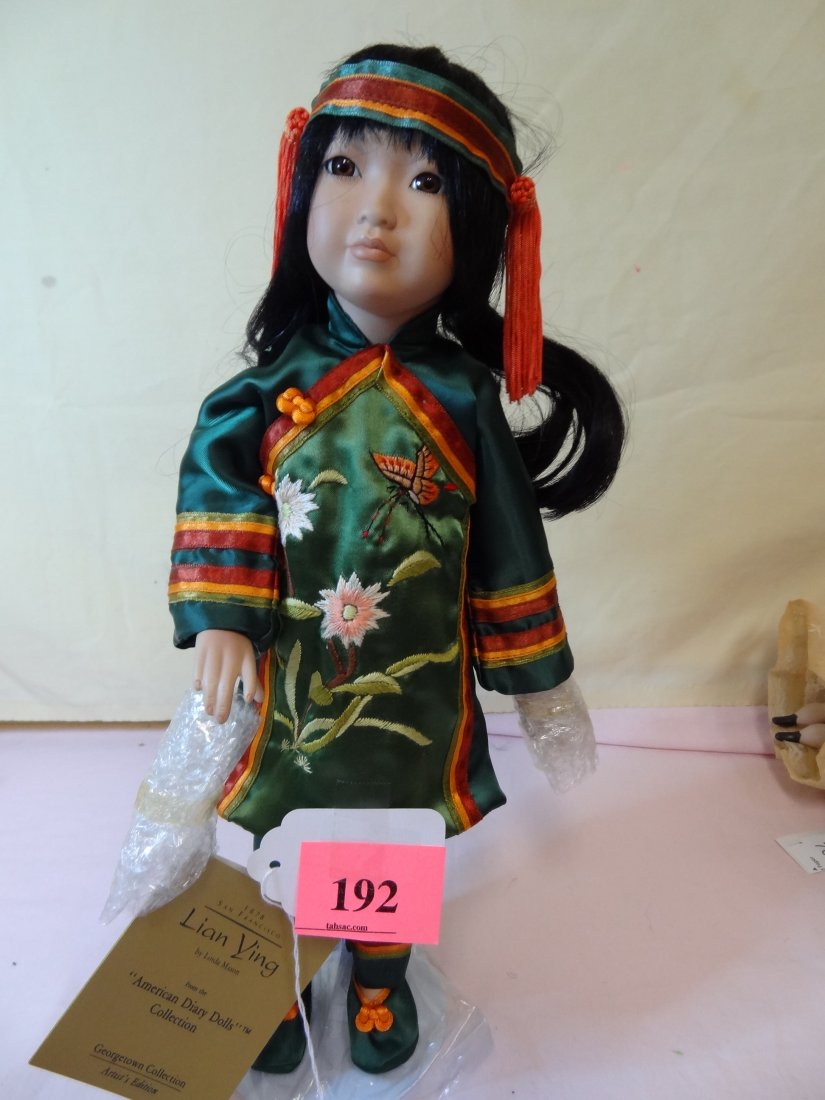 15'' 1878 LIAN YING BY LINDA MASON FROM THE AMERIC: 15'' 1878 LIAN YING BY LINDA MASON FROM THE AMERICAN DIARY DOLL COLLECTION, GEORGETOWN COLLECTION, BISQUE HEAD, ARMS AND LEGS, SOFT CLOTH BODY, BEAUTIFUL EMBROIDERED ASIAN COSTUME, BROWN GLASS EYES AN
