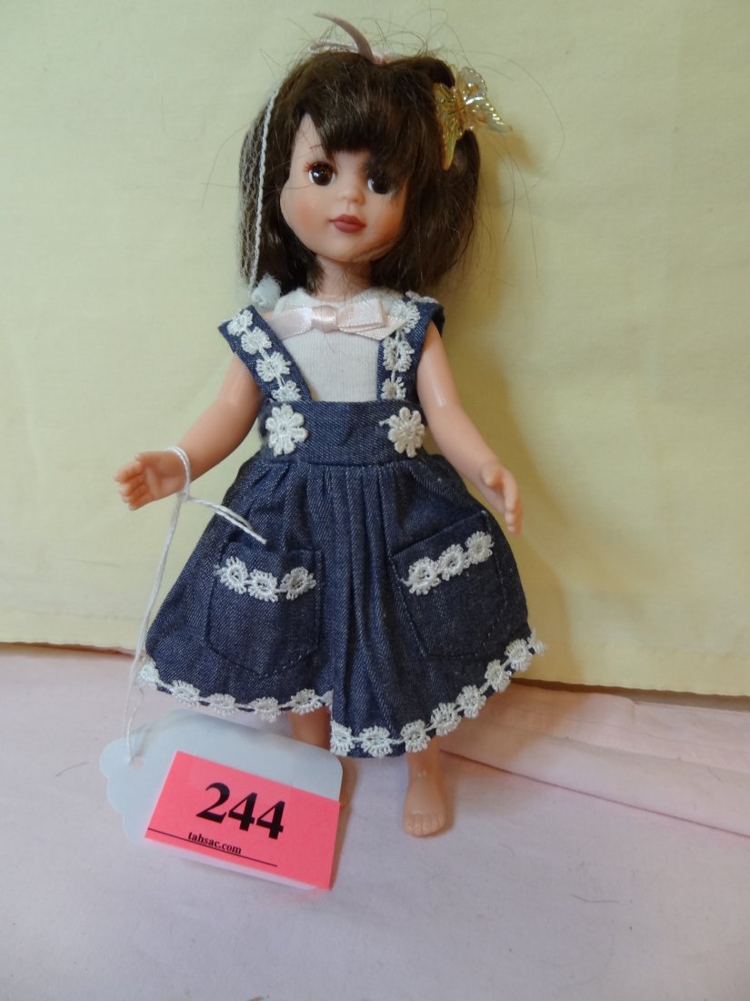8'' PLASTIC DOLL MOVABLE HEAD AND LIMBS, BROWN SLE: 8'' PLASTIC DOLL MOVABLE HEAD AND LIMBS, BROWN SLEEPY EYES, BROWN HAIR, CUTE OUTFIT, MARKED ''TONNER''
