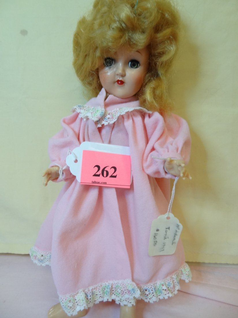 14'' COMPOSITION HEAD, PLASTIC BODY, MOVABLE LIMBS: 14'' COMPOSITION HEAD, PLASTIC BODY, MOVABLE LIMBS, BLONDE HAIR, GREEN SLEEPY EYES, MARKED ''IDEAL DOLL MADE IN U.S.A.'' TAG SAYS ''TONI 1941 $160''