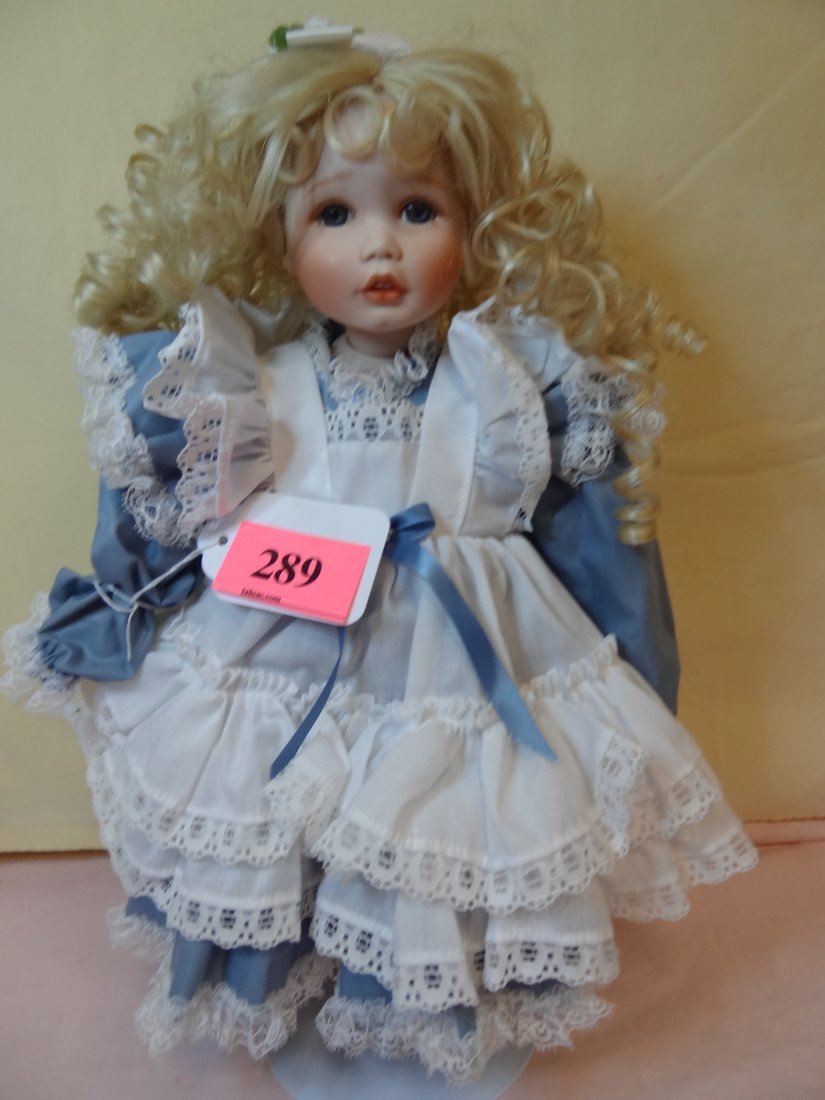 15'' BISQUE HEAD AND LIMBS, CLOTH BODY, BLUE GLASS: 15'' BISQUE HEAD AND LIMBS, CLOTH BODY, BLUE GLASS EYES, BLONDE LONG CURLS, OPEN MOUTH WITH TEETH, FOOT REPAIRED, SWEET LITTLE LAYERED BLUE AND WHITE DRESS, MARKED ''_/1000 CONNIE WALSER DUKE''